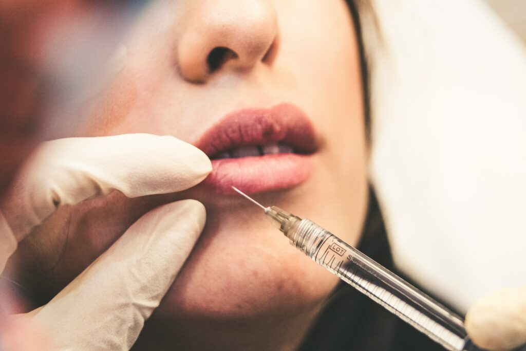 Client receiving a professional facial treatment at Inspo Med Spa in Coral Springs, South Florida.